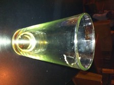 an empty glass that once contained Bell's stout ale