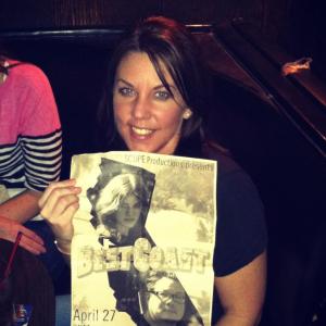 holding best coast poster